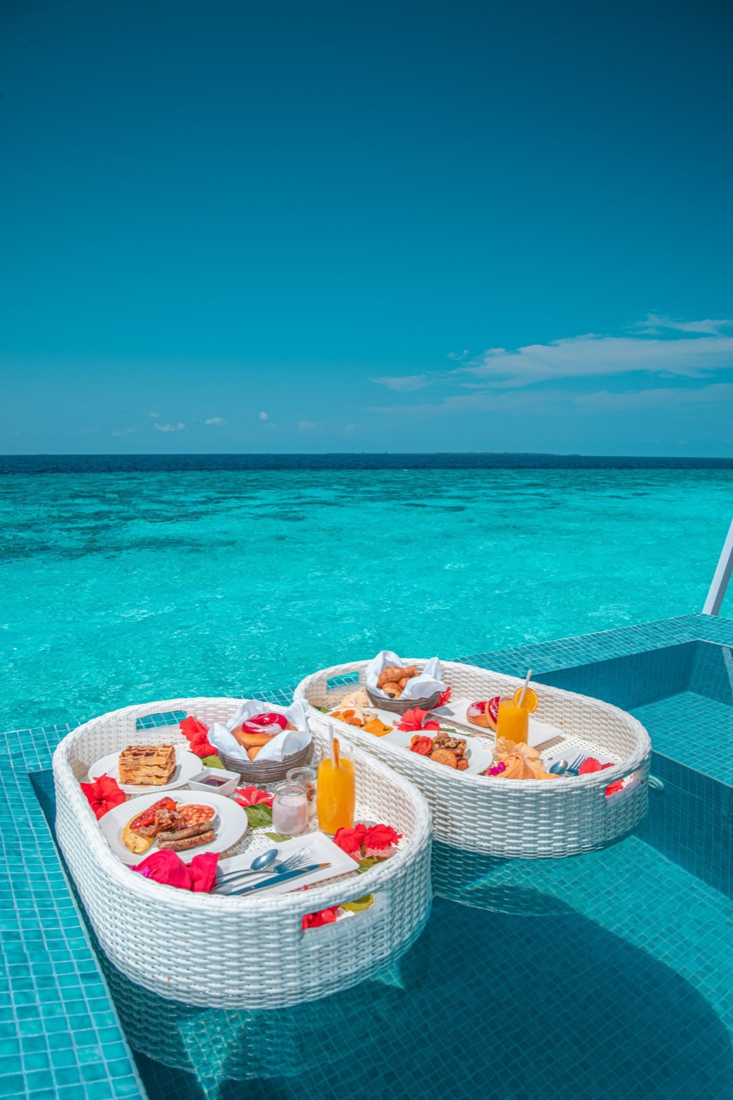 Floating breakfast in an overwater villa